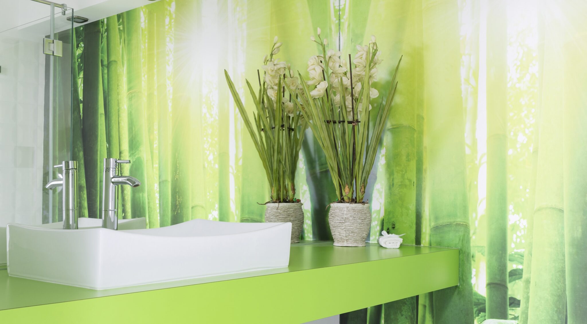 Full wall printed glass splashback with image of green bamboo by Artform Collective.