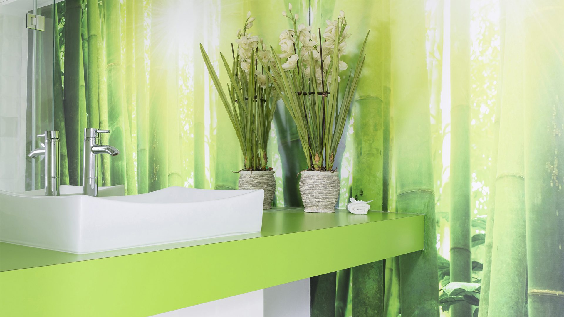 Full wall printed glass splashback with image of green bamboo by Artform Collective.